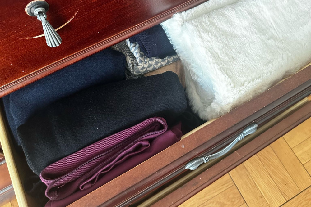 Neatly folded and organized clothing after professional laundry service